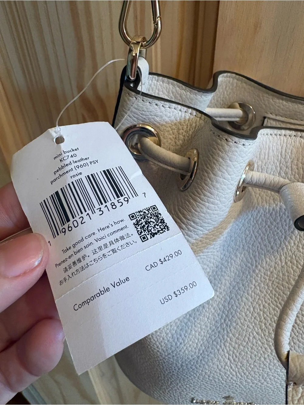 kate spade Cream Pebbled Leather Drawstring Crossbody with Striped Strap